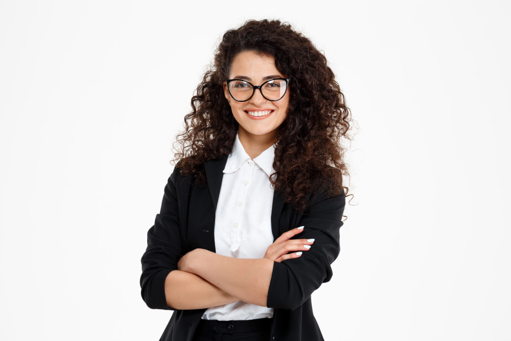 cheerful curly business girl wearing glasses 2 min